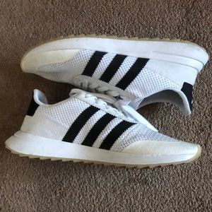 white sneakers with black stripes